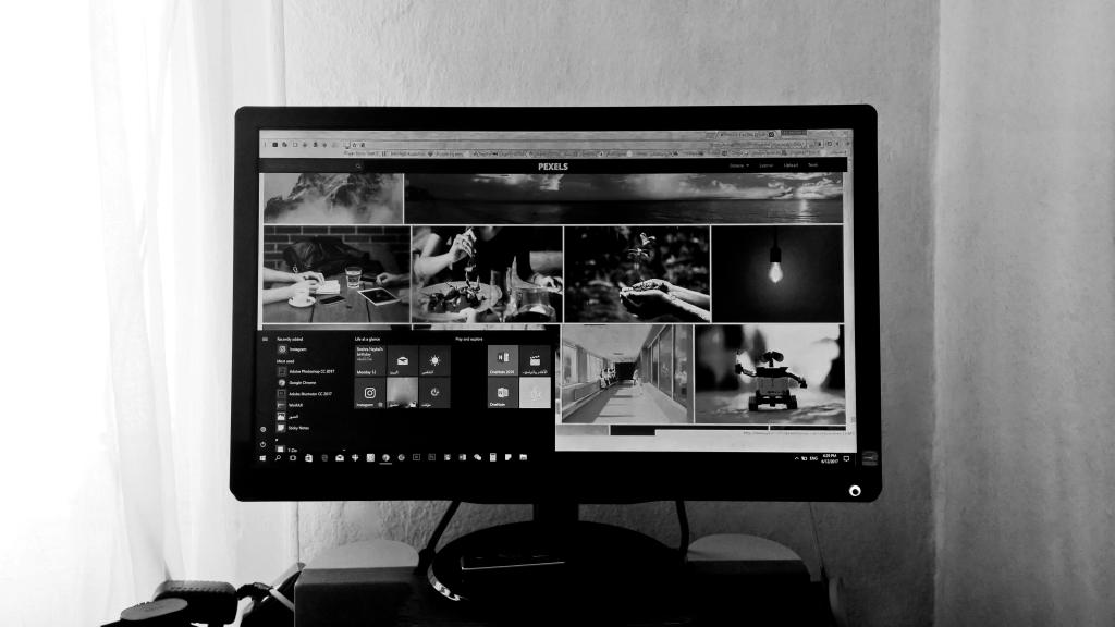 black and white laptop screen showing different images